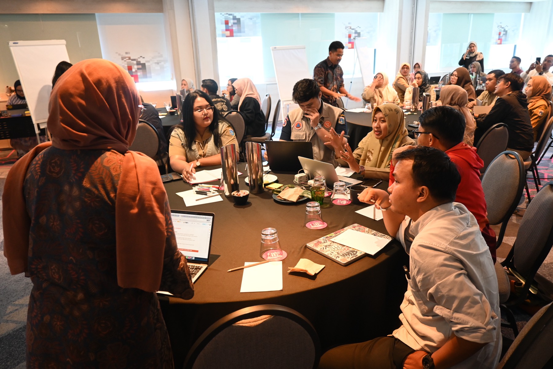 Civil servants working through inclusive climate action in small groups
