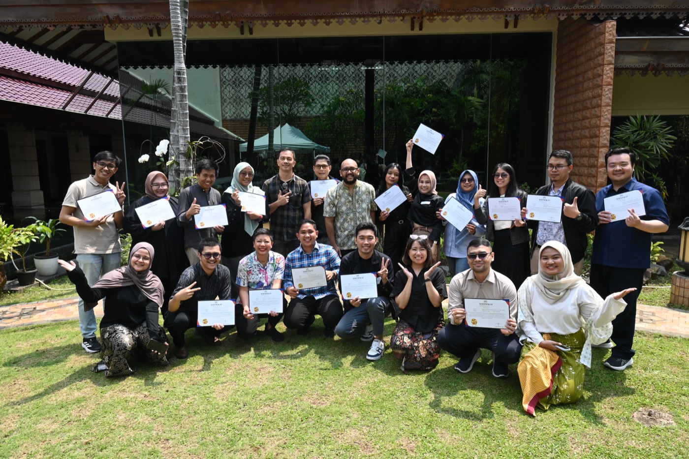 Volunteers and community members gathered with certificates